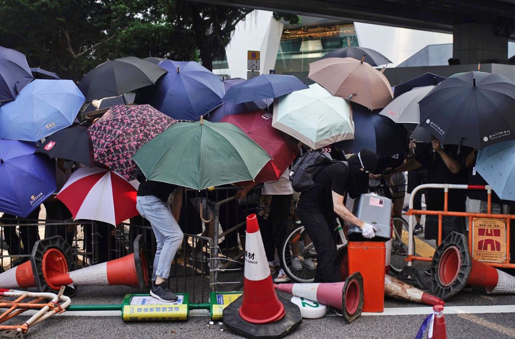 Der Regenschirm ist in Hongkong Zeichen des Protestes. Foto: dpa/Felipe Dana