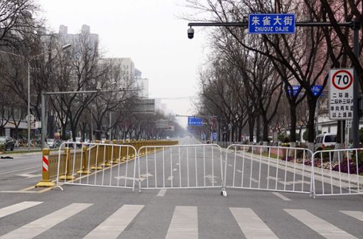 Eine Stadt in China befindet sich im Lockdown, nachdem drei Coronafälle aufgetreten waren (Symbolfoto). Foto: AFP/STR